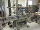 Used Equipment Express 8 Head Gravity Overflow Filler. Stainless Steel With Conveyor & Recirculation Pump