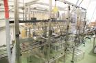 Used Epak 16 Head Inline Gravity Overflow Filler. It has 16 3/4