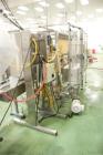 Used Epak 16 Head Inline Gravity Overflow Filler. It has 16 3/4