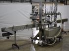 Used Accutek APOF Series Automatic Pressure 6 Head Overflow Filler, Model APOF-6. (6) Stainless steel nozzles, 4.5
