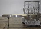 Used Accutek APOF Series Automatic Pressure 6 Head Overflow Filler, Model APOF-6. (6) Stainless steel nozzles, 4.5