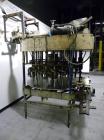 Used Biner-Ellison 18 Head Rotary Gravity/Pressure Filler, Model F-52-TDP-18. Has 1/2