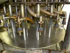 Used Biner-Ellison 18 Head Rotary Gravity/Pressure Filler, Model F-52-TDP-18. Has 1/2