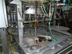 Used Biner Ellison Rotary Gravity Pressure Filler.  Last running wash and wax products.
