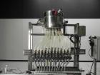 Used ELF (E-PAK) Model 15 CONV 12 Head Inline Time Gravity Pressure Liquid Filler. Capable of speeds over 100 bottles per minute. Has pin indexing system. Neck pneumatic guides. Has a machine mounted...