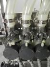 Used ELF (E-PAK) Model 15 CONV 12 Head Inline Time Gravity Pressure Liquid Filler. Capable of speeds over 100 bottles per minute. Has pin indexing system. Neck pneumatic guides. Has a machine mounted...