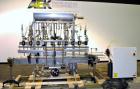 Used Fluid Packaging Solutions 12 Head Inline Automatic Time / Gravity Liquid Filler. Fabricated with 4-1/2
