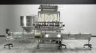 Used Inline Filling Systems 12 head inline time gravity filler. Capable of speeds over 100 bottle per minute. Has star wheel indexing system, neck guides, drip tray, and 12 'long x 4-1/2