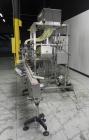 Used Inline Filling Systems 12 head inline time gravity filler. Capable of speeds over 100 bottle per minute. Has star wheel indexing system, neck guides, drip tray, and 12 'long x 4-1/2