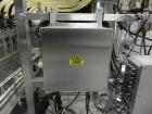 Used Inline Filling Systems 12 head inline time gravity filler. Capable of speeds over 100 bottle per minute. Has star wheel indexing system, neck guides, drip tray, and 12 'long x 4-1/2