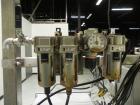 Used Inline Filling Systems 12 head inline time gravity filler. Capable of speeds over 100 bottle per minute. Has star wheel indexing system, neck guides, drip tray, and 12 'long x 4-1/2