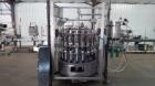 Used Pneumatic Scale Pneumaflow-2 Filler, 20 Heads, previously used to fill 4 ounce bottles.