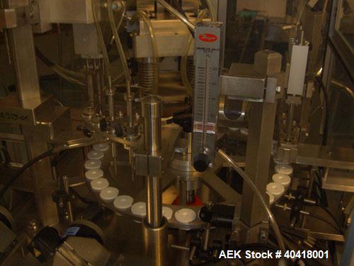 Used Comas model FD120 monoblock filler, stopper and aluminum crimper. Unit dose filler, barrel syringe bowl feeder, dual lanes, two smaller bowls for over cap. Last used for topical, ceramic ivac pu...
