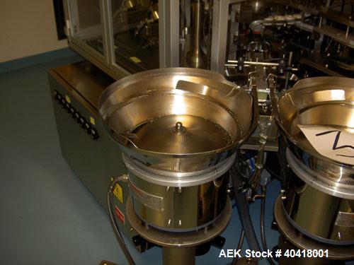 Used Comas model FD120 monoblock filler, stopper and aluminum crimper. Unit dose filler, barrel syringe bowl feeder, dual lanes, two smaller bowls for over cap. Last used for topical, ceramic ivac pu...
