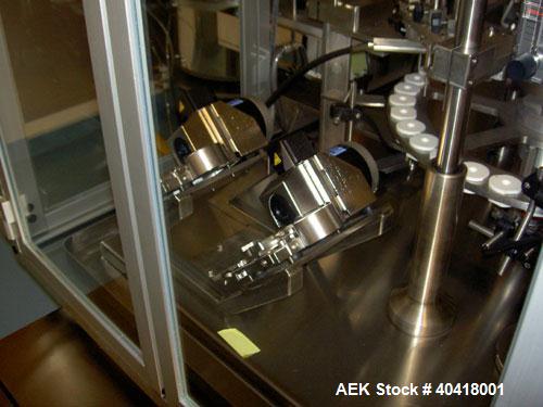 Used Comas model FD120 monoblock filler, stopper and aluminum crimper. Unit dose filler, barrel syringe bowl feeder, dual lanes, two smaller bowls for over cap. Last used for topical, ceramic ivac pu...