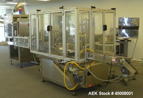 Used Comas Monoblock Line for Fill/Plug/Cap consisting of: (1) Comas Model RS6 Monoblock Filler, Tipper and screw Capper with Integrated Palace Model P2V5 Bulk bottle unscrambler. Has two head perist...