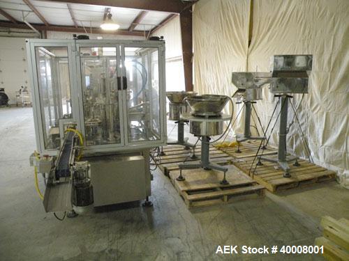 Used Comas Monoblock Line for Fill/Plug/Cap consisting of: (1) Comas Model RS6 Monoblock Filler, Tipper and screw Capper with Integrated Palace Model P2V5 Bulk bottle unscrambler. Has two head perist...