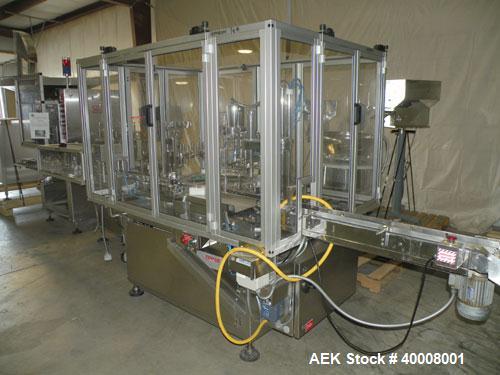 Used Comas Monoblock Line for Fill/Plug/Cap consisting of: (1) Comas Model RS6 Monoblock Filler, Tipper and screw Capper with Integrated Palace Model P2V5 Bulk bottle unscrambler. Has two head perist...
