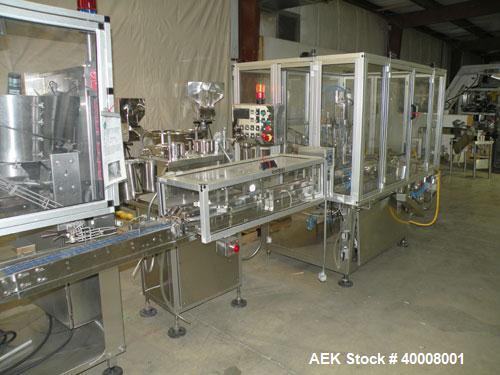 Used Comas Monoblock Line for Fill/Plug/Cap consisting of: (1) Comas Model RS6 Monoblock Filler, Tipper and screw Capper with Integrated Palace Model P2V5 Bulk bottle unscrambler. Has two head perist...