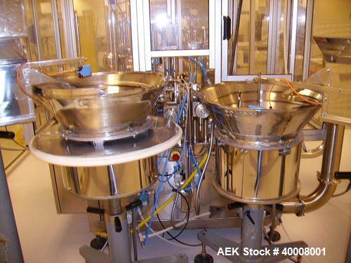 Used Comas Monoblock Line for Fill/Plug/Cap consisting of: (1) Comas Model RS6 Monoblock Filler, Tipper and screw Capper with Integrated Palace Model P2V5 Bulk bottle unscrambler. Has two head perist...