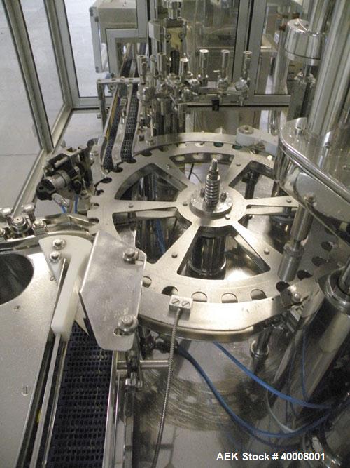 Used Comas Monoblock Line for Fill/Plug/Cap consisting of: (1) Comas Model RS6 Monoblock Filler, Tipper and screw Capper with Integrated Palace Model P2V5 Bulk bottle unscrambler. Has two head perist...