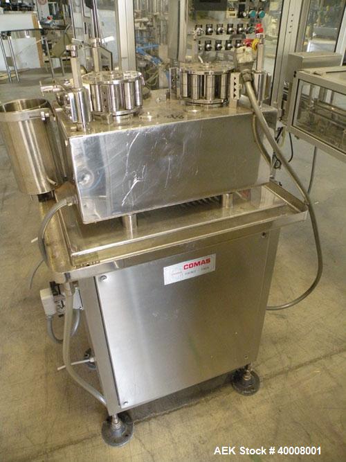 Used Comas Monoblock Line for Fill/Plug/Cap consisting of: (1) Comas Model RS6 Monoblock Filler, Tipper and screw Capper with Integrated Palace Model P2V5 Bulk bottle unscrambler. Has two head perist...