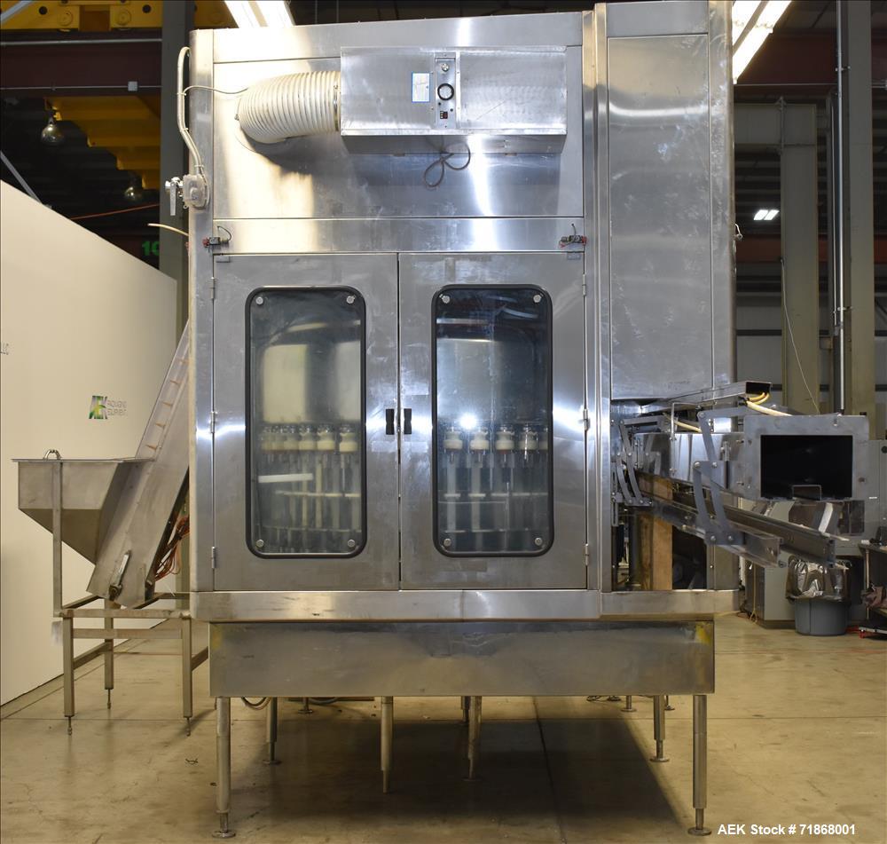 Used Fogg Model FA4214 High Speed Monoblock Liquid Filler and Capper.
