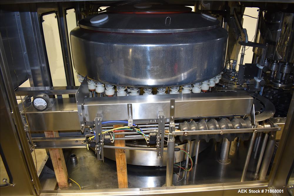Used Fogg Model FA4214 High Speed Monoblock Liquid Filler and Capper.
