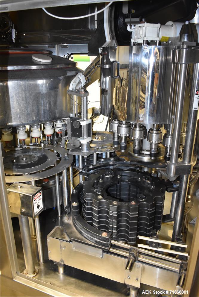 Used Fogg Model FA4214 High Speed Monoblock Liquid Filler and Capper.