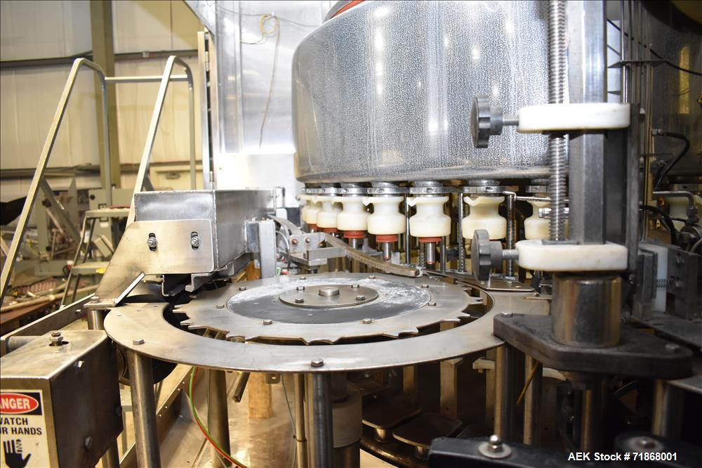 Used Fogg Model FA4214 High Speed Monoblock Liquid Filler and Capper.