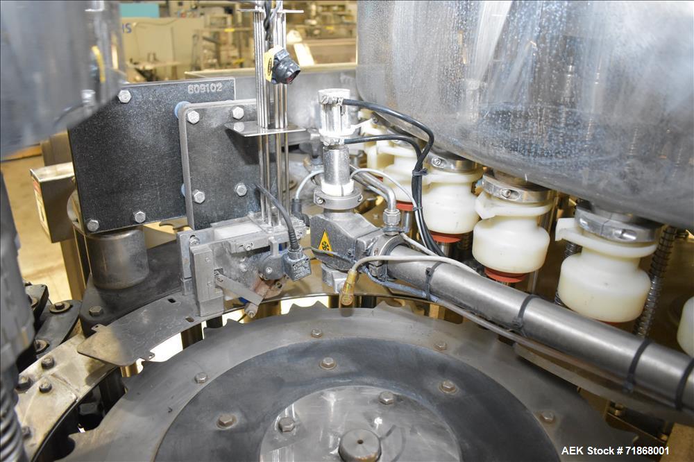 Used Fogg Model FA4214 High Speed Monoblock Liquid Filler and Capper.