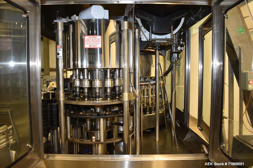 Used Fogg Model FA4214 High Speed Monoblock Liquid Filler and Capper.