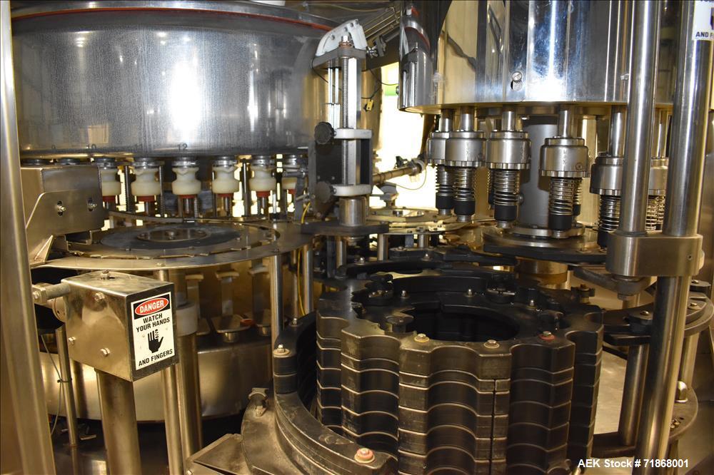 Used Fogg Model FA4214 High Speed Monoblock Liquid Filler and Capper.