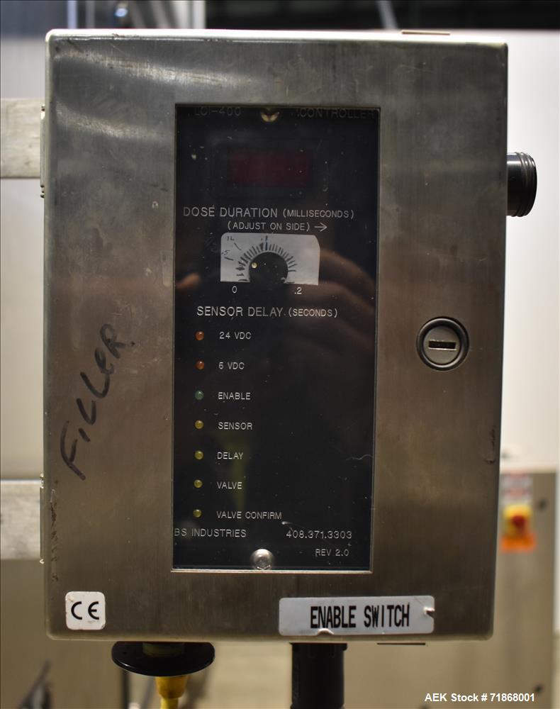 Used Fogg Model FA4214 High Speed Monoblock Liquid Filler and Capper.
