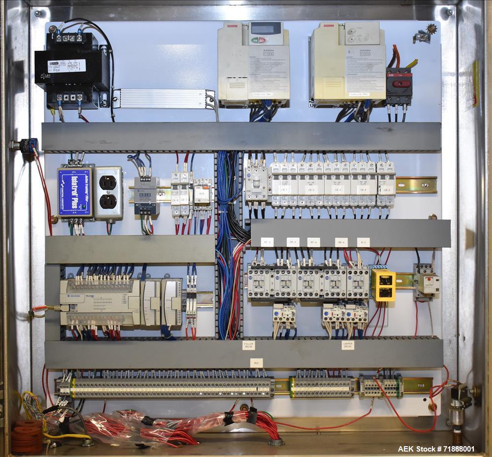 Used Fogg Model FA4214 High Speed Monoblock Liquid Filler and Capper.