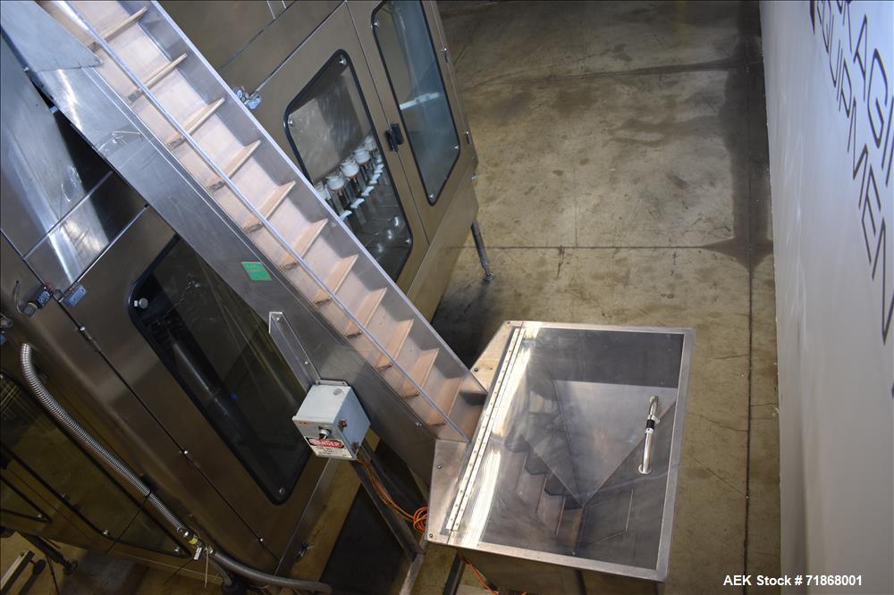 Used Fogg Model FA4214 High Speed Monoblock Liquid Filler and Capper.