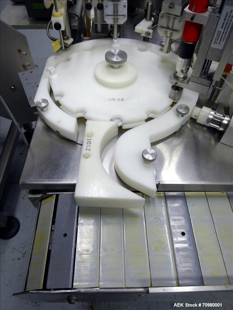 Used M&O Perry P-3000 II Monoblock Unscrambler, Filler, Plugger, and Screw Capper. Capable of speeds up to 35 bottles per minute. Has Watson Marlow Model 505Di Single head, peristaltic pump filler, H...