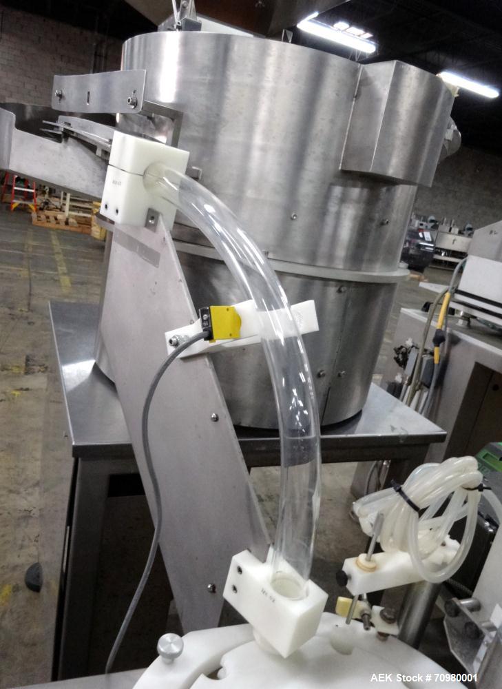 Used M&O Perry P-3000 II Monoblock Unscrambler, Filler, Plugger, and Screw Capper. Capable of speeds up to 35 bottles per minute. Has Watson Marlow Model 505Di Single head, peristaltic pump filler, H...