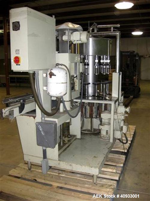 Used Seitz (KHS Filling) Monoblock 12 Head Rotary Wine Filler and Corker. Capable of speeds up to 60 BPM. Has 5/8" diameter nozzles on 6-3/8" centers. Complete with platform base, vacuum pump, star t...