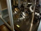 Used Comas model FD120 monoblock filler, stopper and aluminum crimper. Unit dose filler, barrel syringe bowl feeder, dual lanes, two smaller bowls for over cap. Last used for topical, ceramic ivac pu...