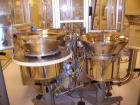 Used Comas Monoblock Line for Fill/Plug/Cap consisting of: (1) Comas Model RS6 Monoblock Filler, Tipper and screw Capper with Integrated Palace Model P2V5 Bulk bottle unscrambler. Has two head perist...