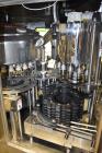 Used Fogg Model FA4214 High Speed Monoblock Liquid Filler and Capper.