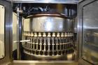Used Fogg Model FA4214 High Speed Monoblock Liquid Filler and Capper.