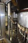 Used Fogg Model FA4214 High Speed Monoblock Liquid Filler and Capper.