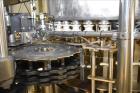 Used Fogg Model FA4214 High Speed Monoblock Liquid Filler and Capper.