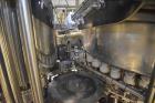 Used Fogg Model FA4214 High Speed Monoblock Liquid Filler and Capper.