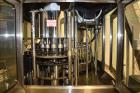 Used Fogg Model FA4214 High Speed Monoblock Liquid Filler and Capper.