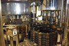 Used Fogg Model FA4214 High Speed Monoblock Liquid Filler and Capper.