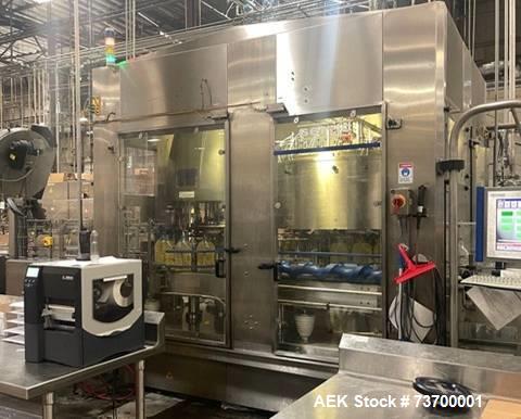 Used Serac Net Weight Rotary Monobloc Liquid Filler, Model 18/6. Has 18 filling nozzles set on a stainless steel turret and 6 cap stations. Has color touchscreen operator HMI and Allen Bradley PLC co...