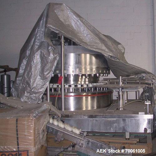 Used Used: Serac Filler Model R36 rotary filler.  Handles containers up to 5-1/2" diam on every spout, minimum height containers: 4". Currently set up with nozzles that have a 2" OD collar, 1-1/2" di...